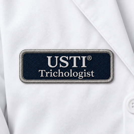 USTI Trichologist embroidered patch on a white lab coat